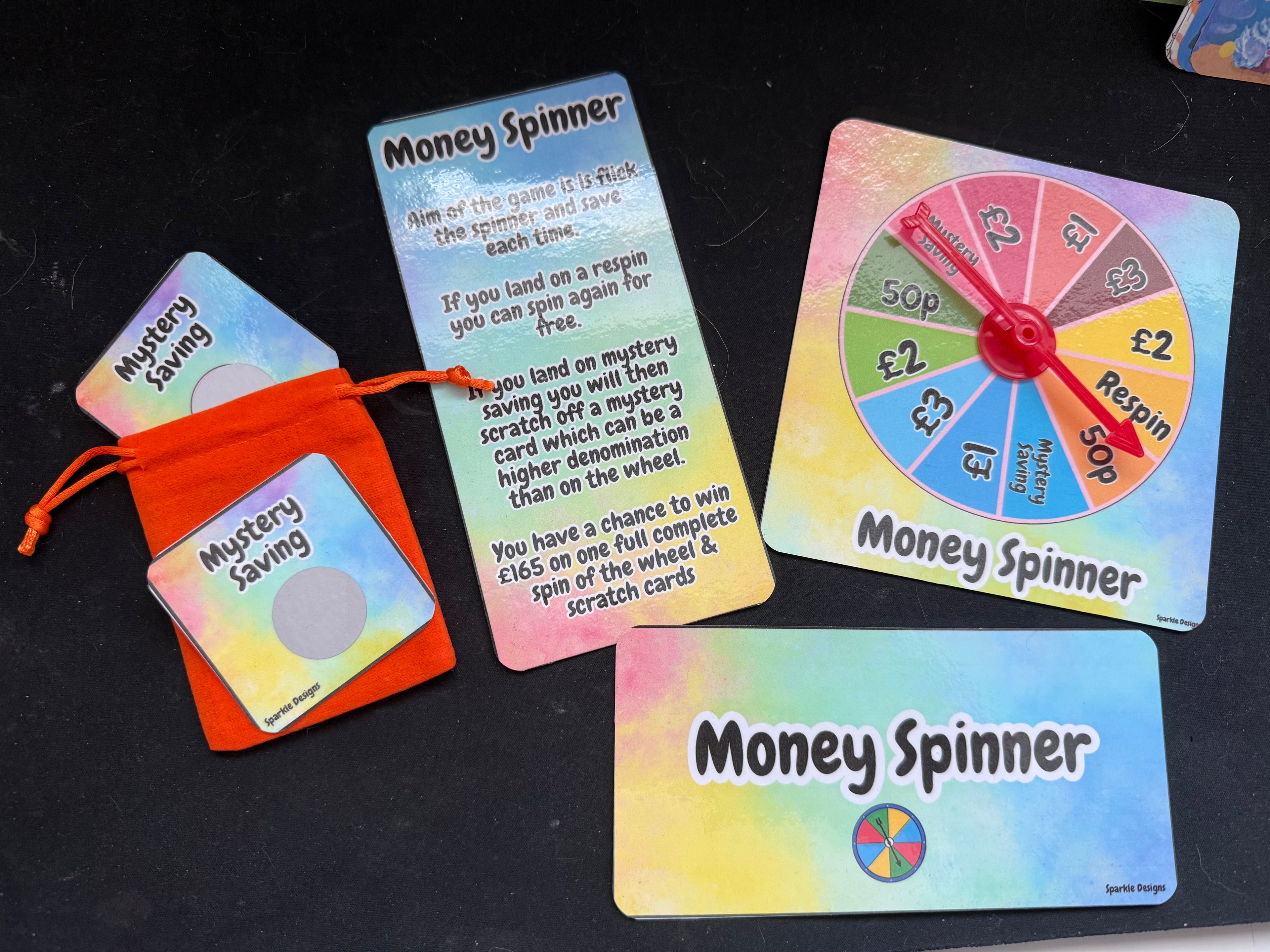 Money Spinner Saving Money Challenge Game Tracker with Mystery Cards and Scratch Off Features for Fun Financial Management